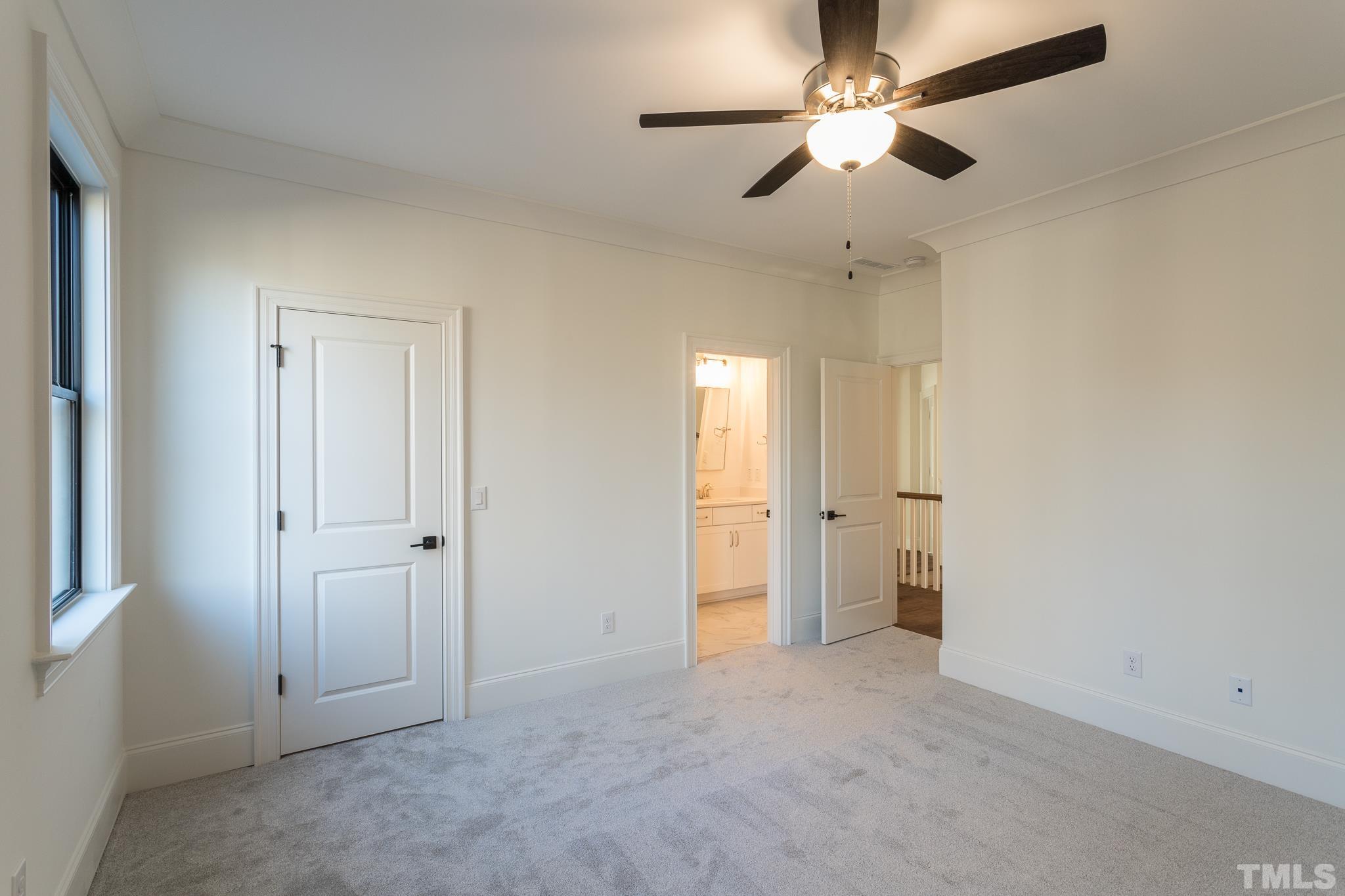 3820 Noremac Drive Raleigh, NC 27612 - Photo 43 of 46 an empty room with chandelier fan and closet area