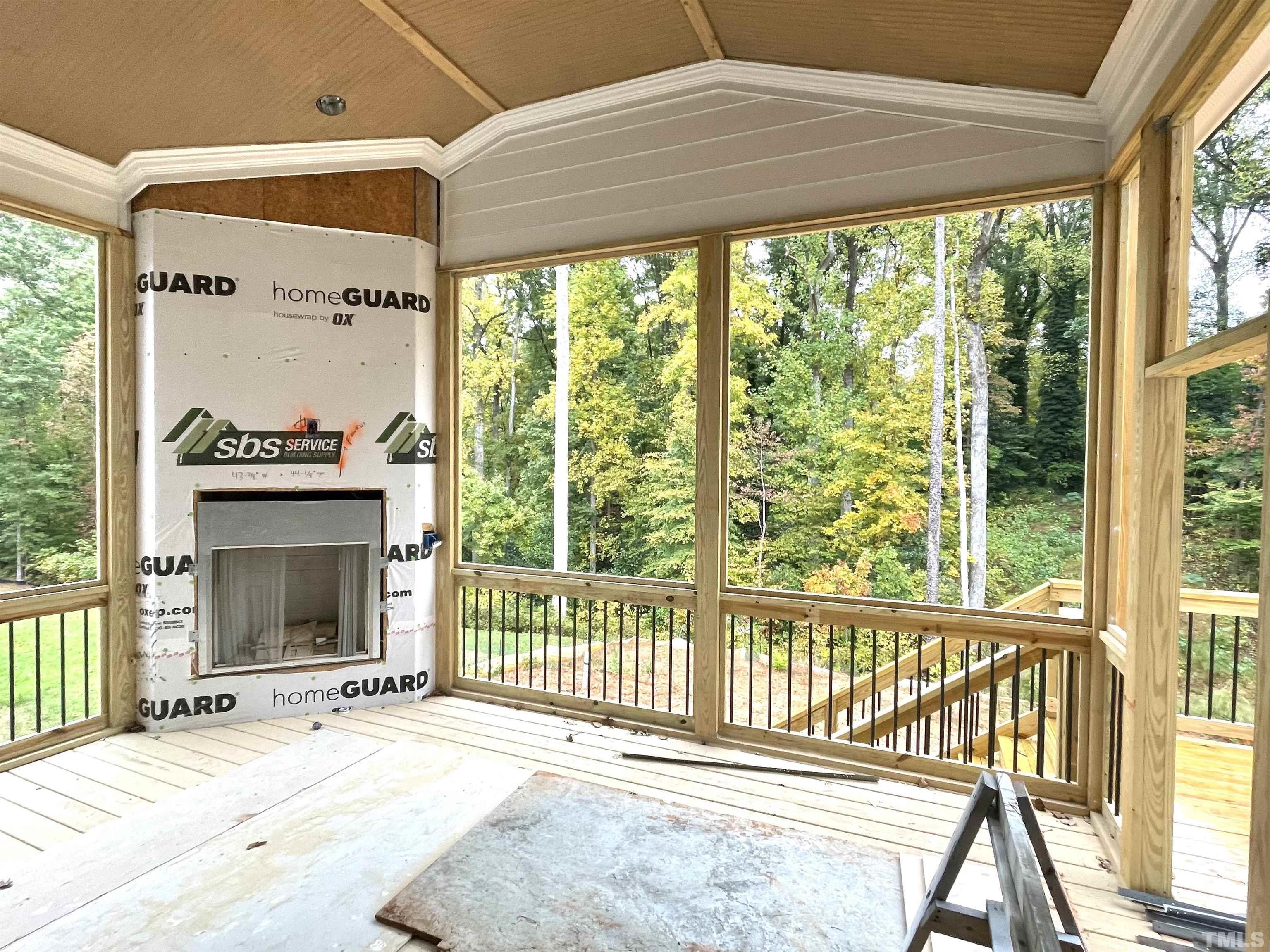 3820 Noremac Drive Raleigh, NC 27612 - Photo 8 of 46 a view of an empty room with a fireplace and a window