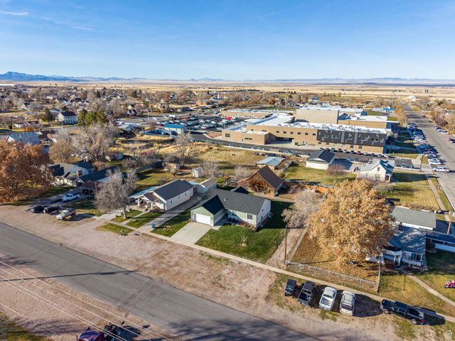 75 North 100th Street West Fillmore, UT 84631 - Photo 57 of 62 Aerial view of residential area with a mountain backdrop