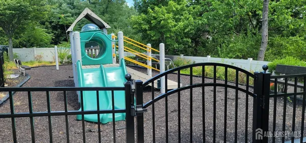 a view of staircase with a small yard