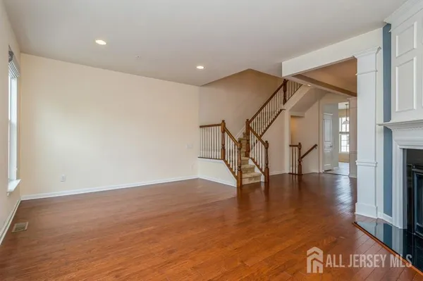 a view of an entryway with wooden floor