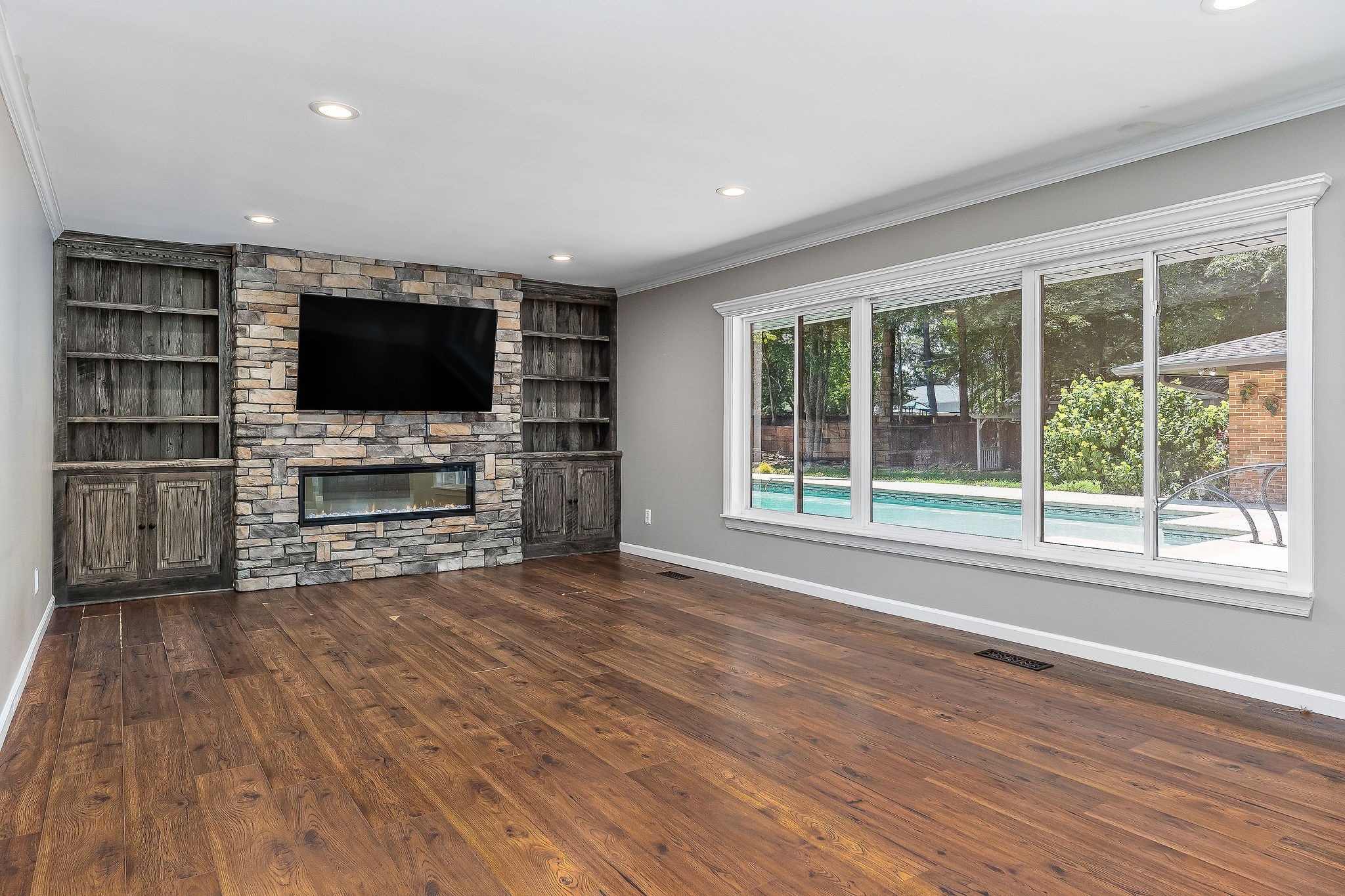 727 Timber Lane Cookeville, TN 38501 - Photo 26 of 68 a view of a livingroom with furniture flat screen tv and floor to ceiling window