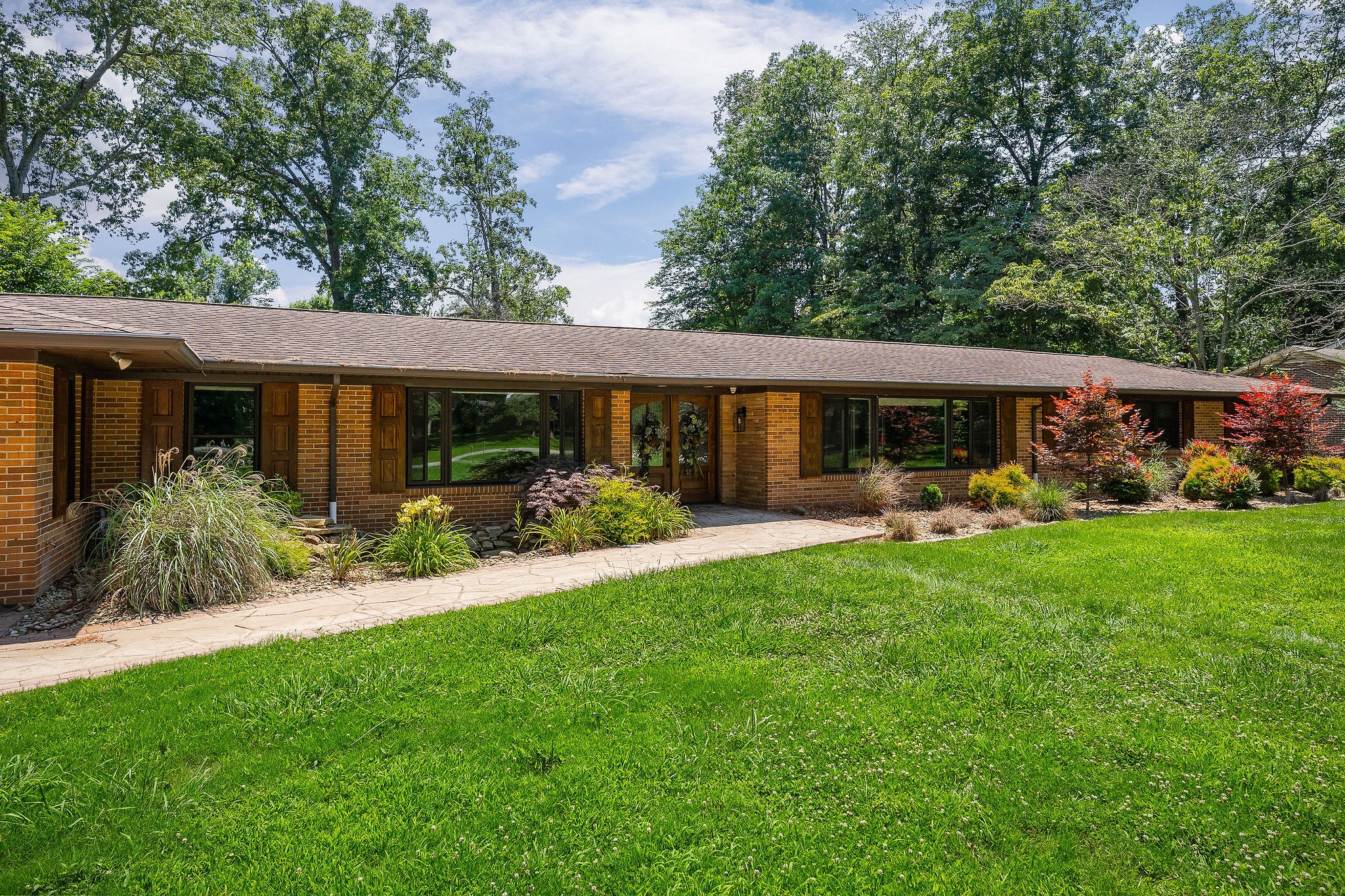 727 Timber Lane Cookeville, TN 38501 - Photo 55 of 68 a view of a house with a yard plants and large tree