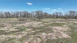 0 Buller Road Brookshire, TX 77423 - Photo 2 of 5 a view of a large outdoor space with green space and fog