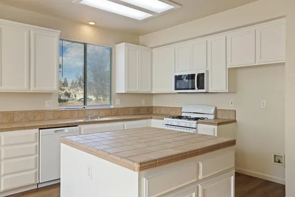 a view of an empty room with a fireplace