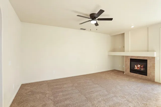 a view of kitchen with granite countertop stove top oven and cabinets