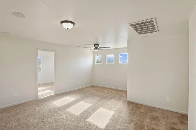 a view of a bathroom with a glass door shower