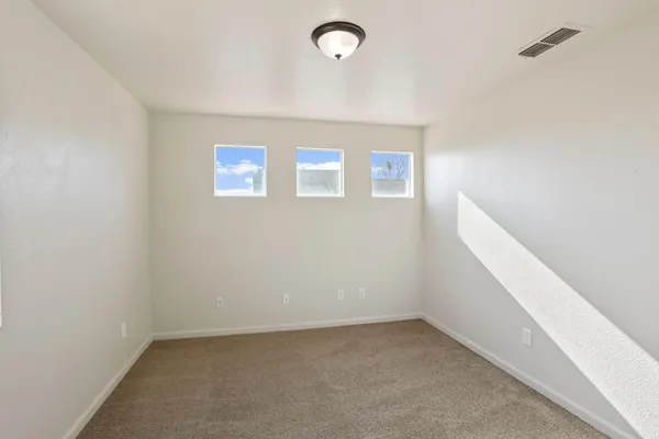 a view of a hallway with closet and wooden floor
