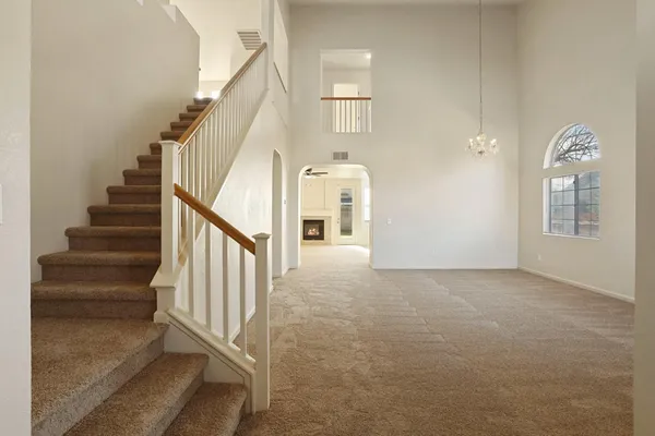 a view of a hallway with staircase