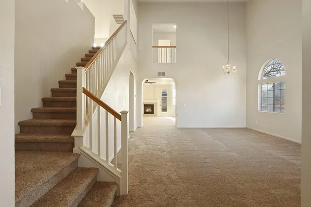a view of a hallway with staircase
