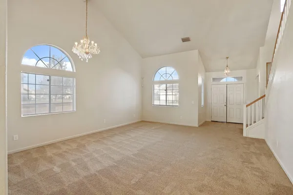 a view of an entryway with a chandelier