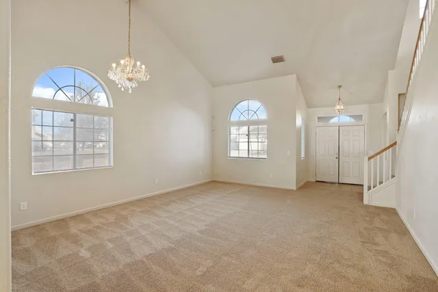 a view of an entryway with a chandelier