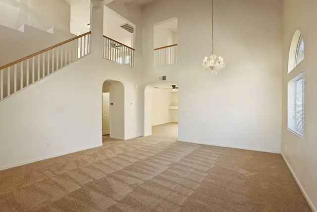 a view of a kitchen with a sink and a refrigerator