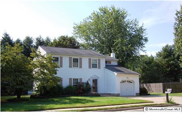 57 Ravatt Road Port Monmouth, NJ 07758 - Photo 1 of 3 a front view of a house with a yard