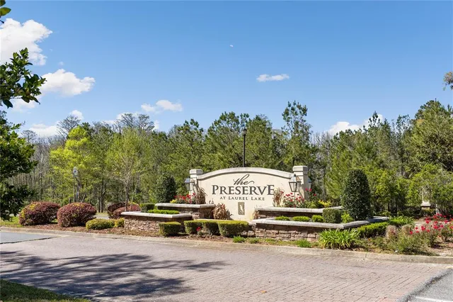 a view of a street with a building in the background