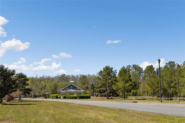 a view of swimming pool and trees in the background