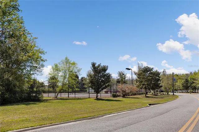 a view of a swimming pool with an outdoor space and seating area