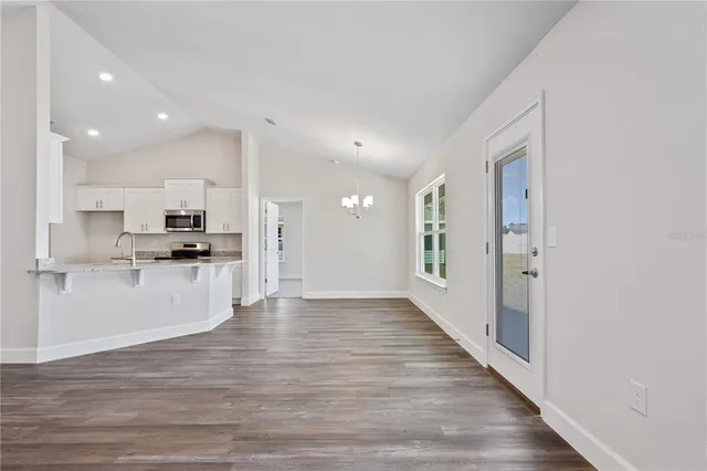 a view of kitchen with wooden floor