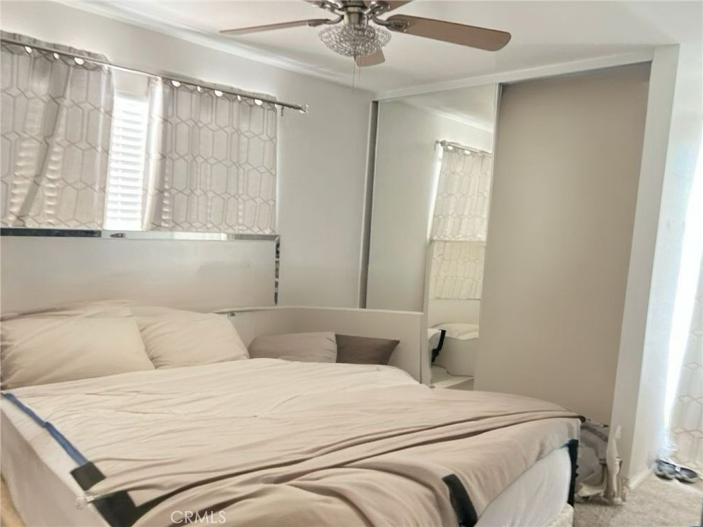 6848 Holbrook Way Riverside, CA 92504 - Photo 3 of 13 a bedroom with a bed and window