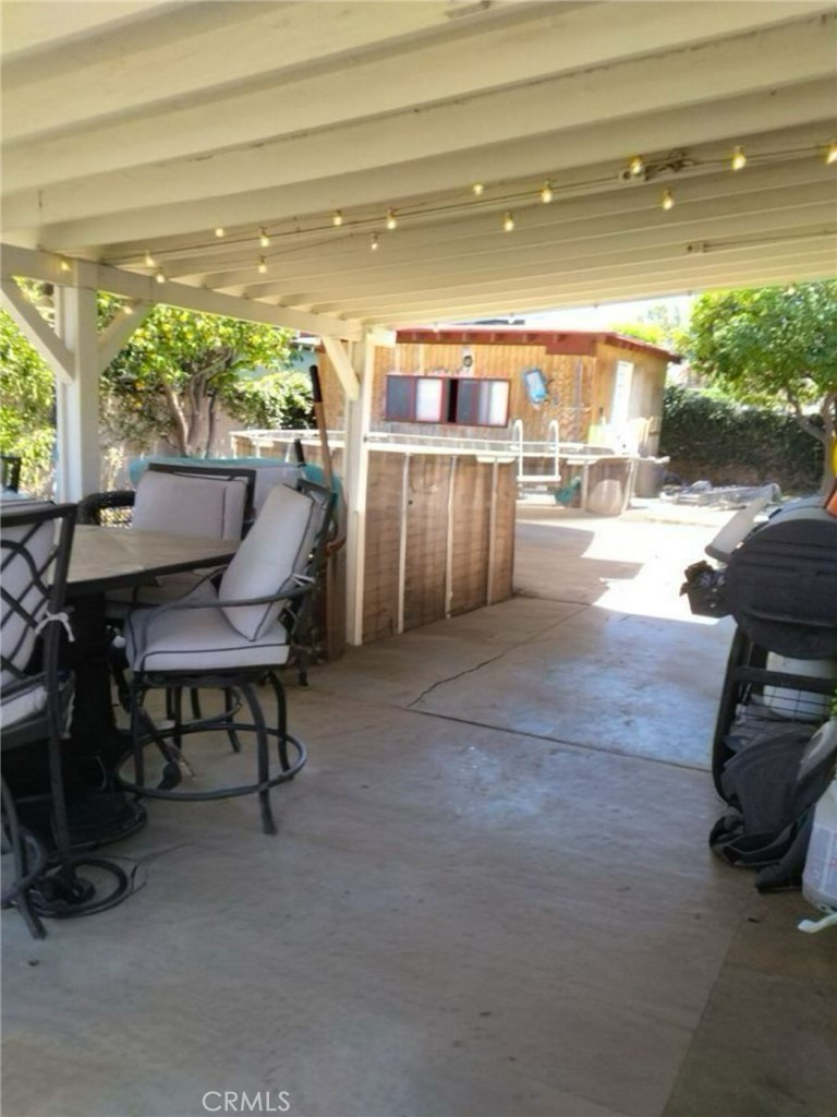 6848 Holbrook Way Riverside, CA 92504 - Photo 4 of 13 a view of a patio with a table and chairs