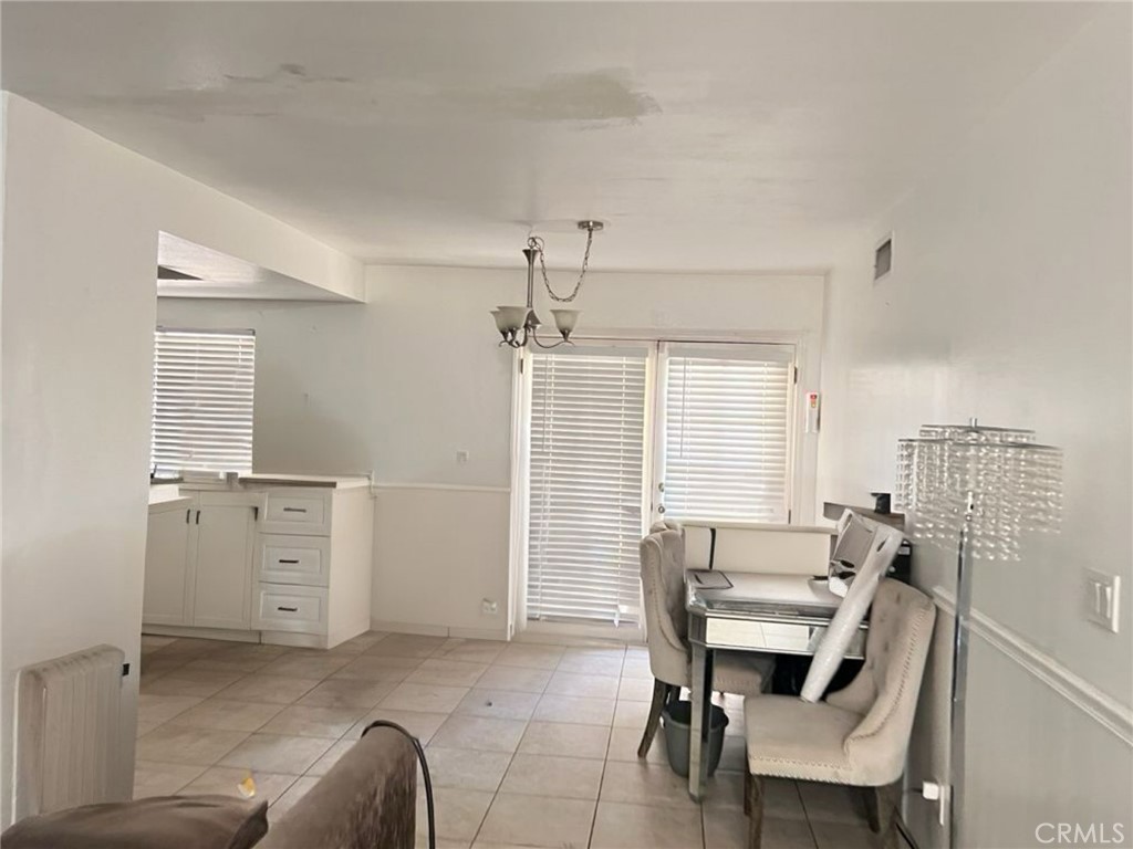 6848 Holbrook Way Riverside, CA 92504 - Photo 6 of 13 a view of a livingroom with furniture and window