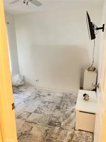 a bathroom with a sink toilet and view of bathroom