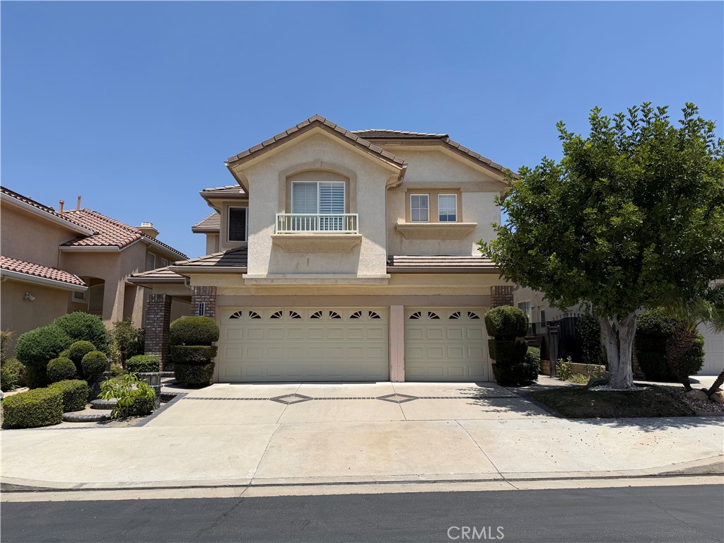 19823 Mariposa Pines Way Porter Ranch, CA 91326 - Photo 2 of 50 a front view of a house with a yard