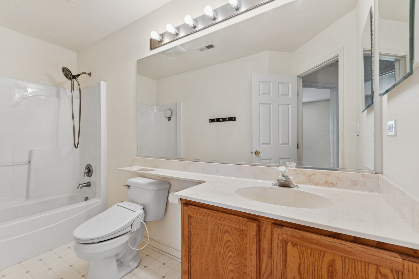1919 Carousel Court, Unit 1919 Joliet, IL 60435 - Photo 19 of 20 a bathroom with a sink toilet vanity and shower