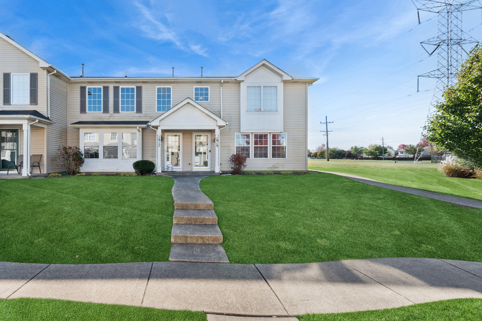 1919 Carousel Court, Unit 1919 Joliet, IL 60435 - Photo 2 of 20 a front view of a house with a yard