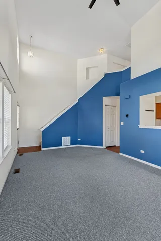 a view of an empty room with windows