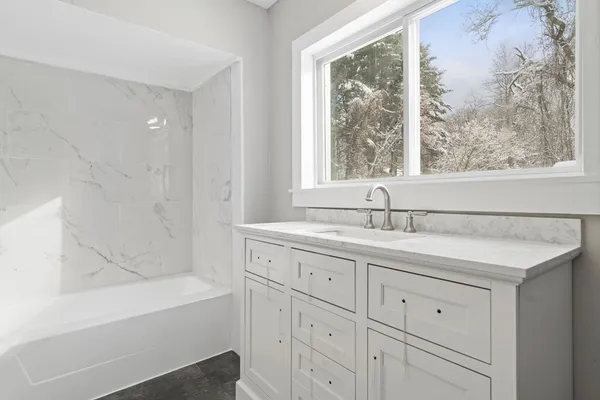 a bathroom with a sink and a bathtub