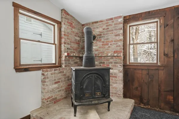 a view of livingroom with furniture workspace and window