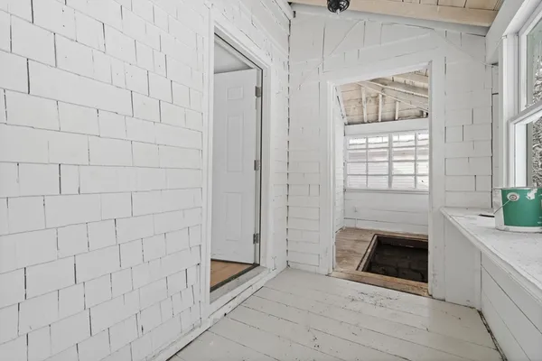a bathroom with a toilet and a mirror