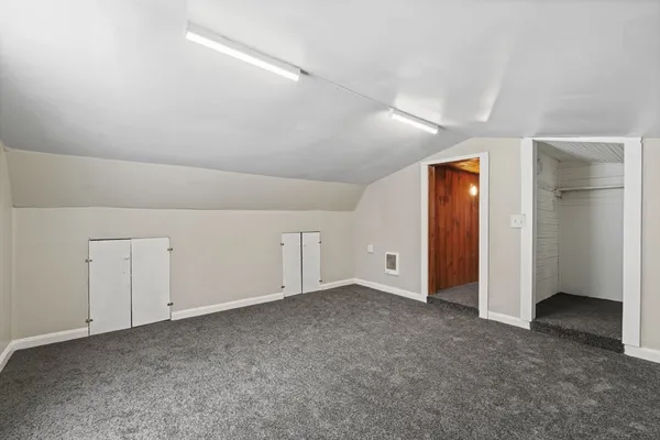 a view of a room with wooden walls