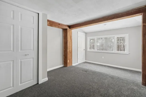 a view of empty room with windows