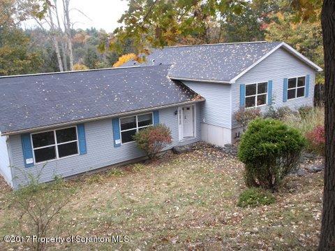 385 Rattlesnake Hill Road Meshoppen, PA 18630 - Photo 1 of 24 a front view of a house with garden