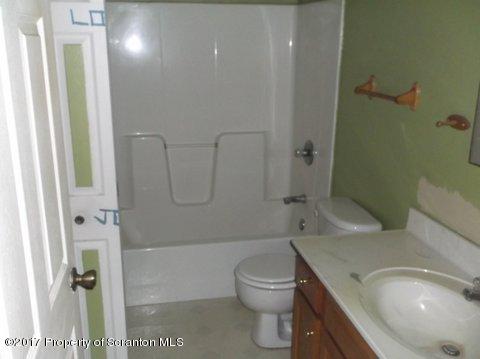 385 Rattlesnake Hill Road Meshoppen, PA 18630 - Photo 15 of 24 a bathroom with a sink a toilet and shower