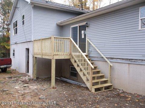 385 Rattlesnake Hill Road Meshoppen, PA 18630 - Photo 5 of 24 a view of a house with stairs and a yard
