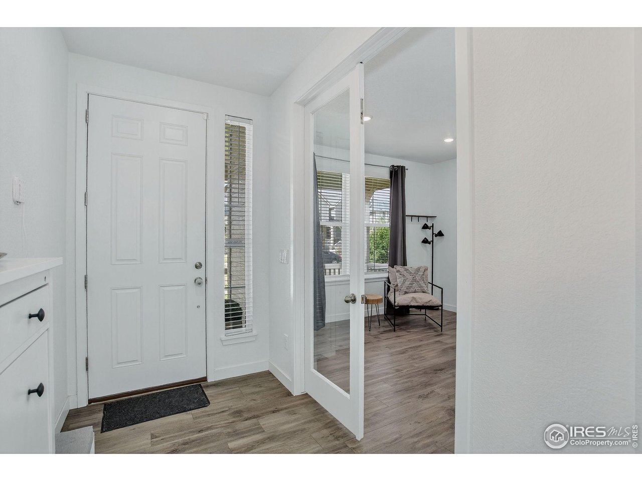 1920 Miranda Road Erie, CO 80516 - Photo 4 of 38 At the front of the home is a dedicated home office with glass doors