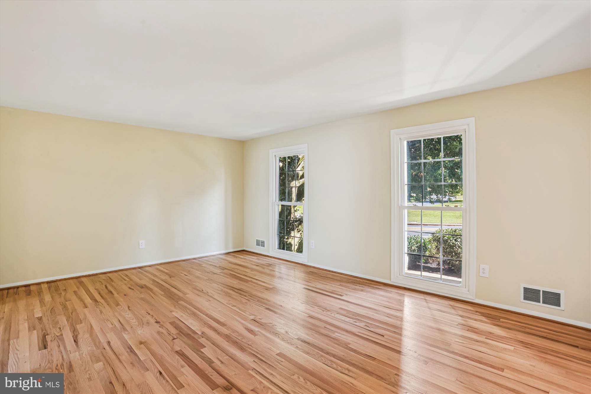 9017 Falls Chapel Way Potomac, MD 20854 - Photo 15 of 70 a view of an empty room with wooden floor and a window
