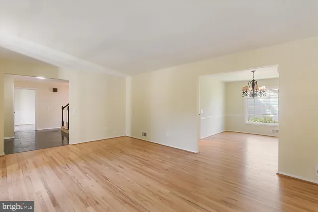 a bathroom with a granite countertop sink mirror vanity and a toilet