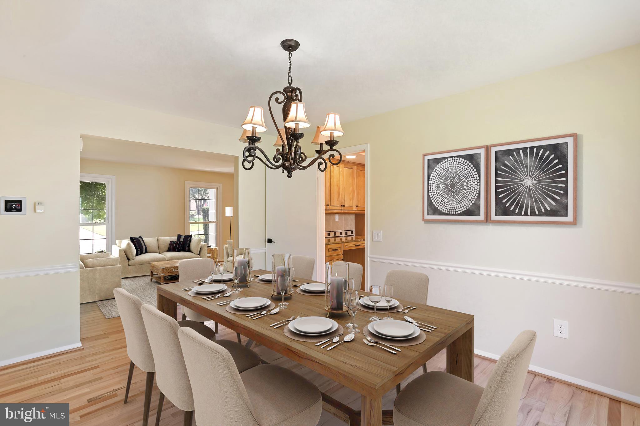 9017 Falls Chapel Way Potomac, MD 20854 - Photo 17 of 70 a view of a dining room with furniture wooden floor and chandelier