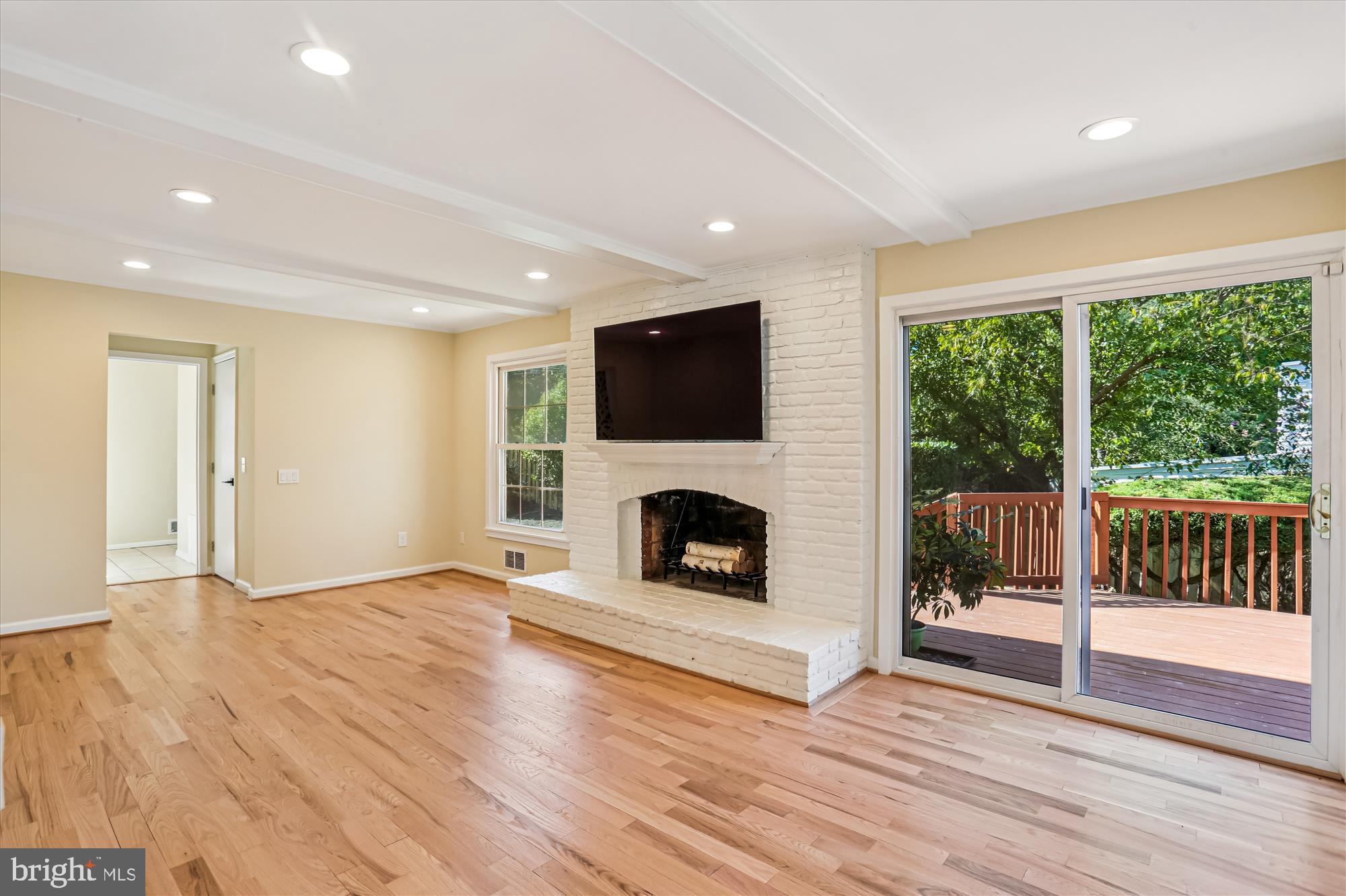 9017 Falls Chapel Way Potomac, MD 20854 - Photo 23 of 70 wooden floor fireplace and natural light in room