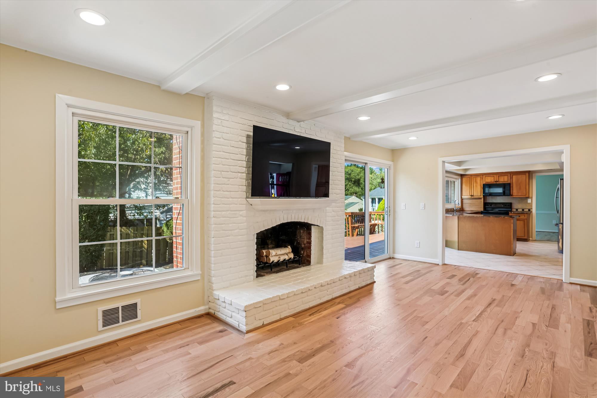 9017 Falls Chapel Way Potomac, MD 20854 - Photo 24 of 70 a view of an empty room with wooden floor and a window