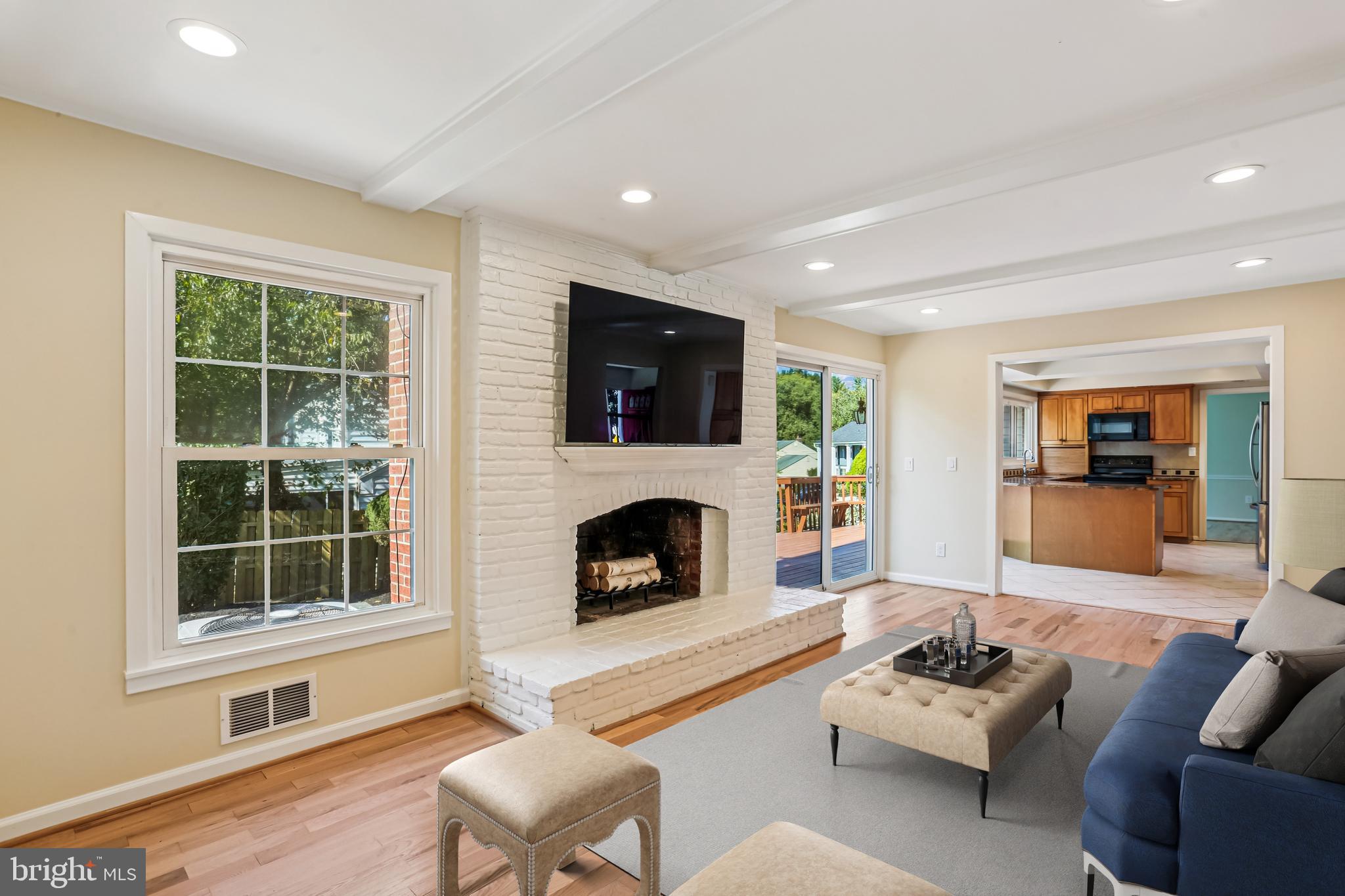 9017 Falls Chapel Way Potomac, MD 20854 - Photo 3 of 70 a living room with furniture mirror and a fireplace