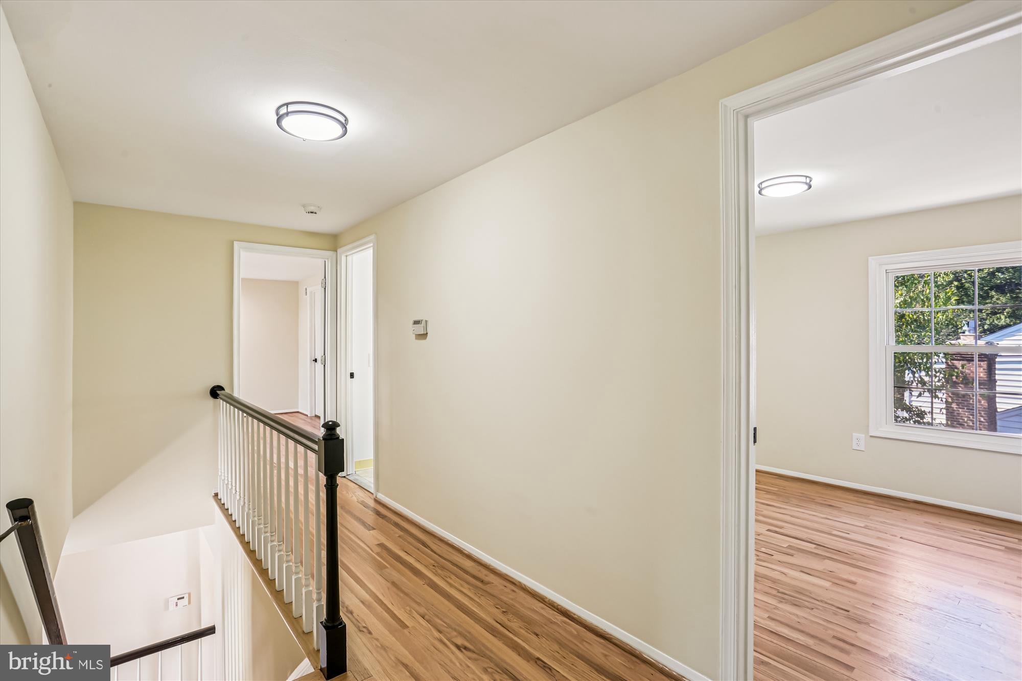 9017 Falls Chapel Way Potomac, MD 20854 - Photo 36 of 70 a view of a hallway with wooden floor and staircase