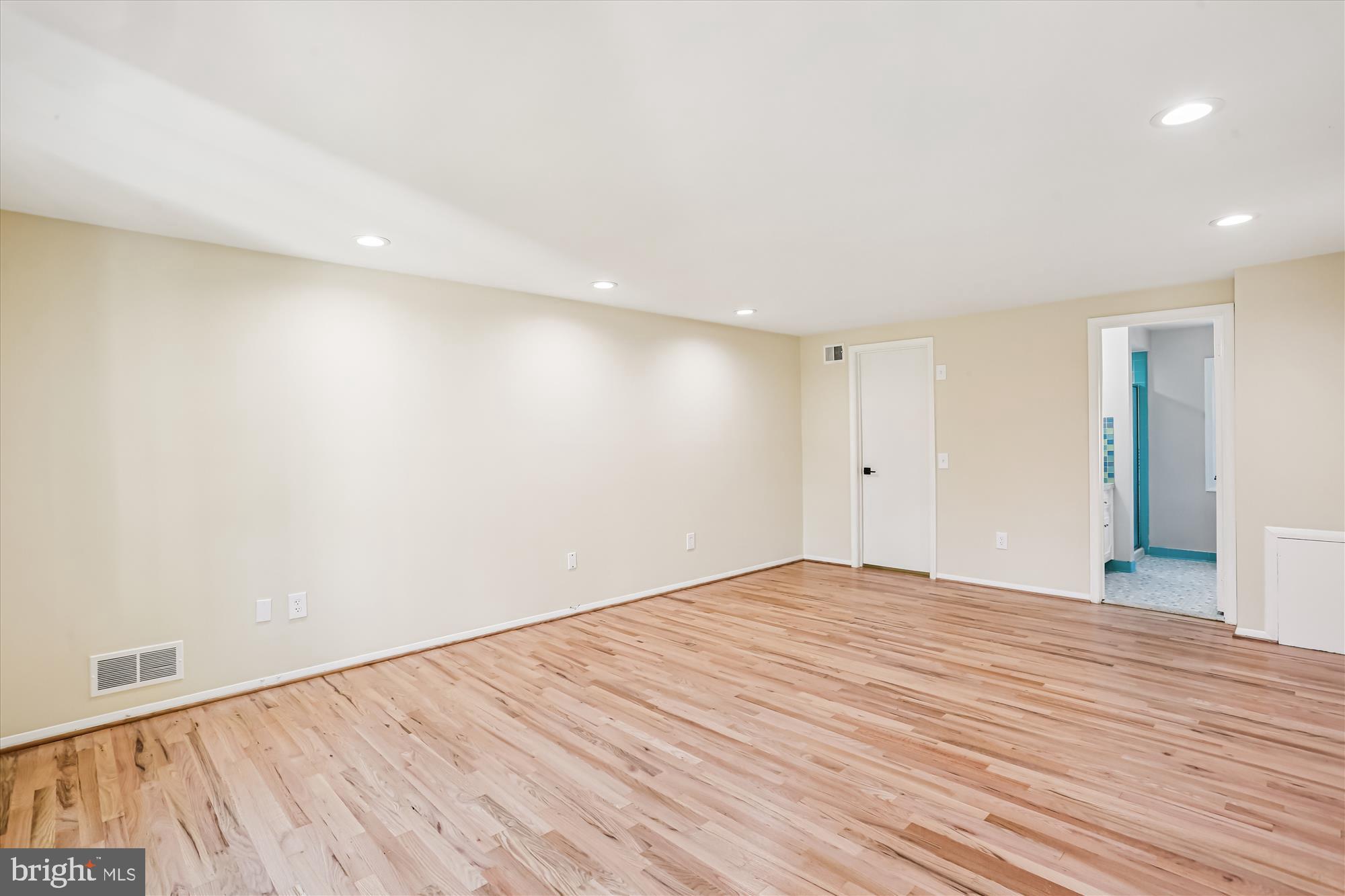 9017 Falls Chapel Way Potomac, MD 20854 - Photo 39 of 70 a view of an empty room with wooden floor
