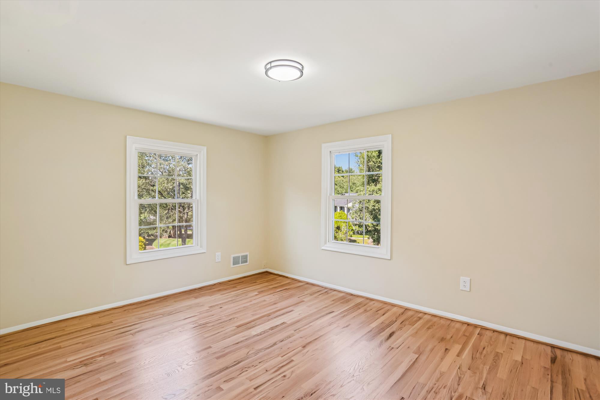 9017 Falls Chapel Way Potomac, MD 20854 - Photo 49 of 70 an empty room with wooden floor and windows