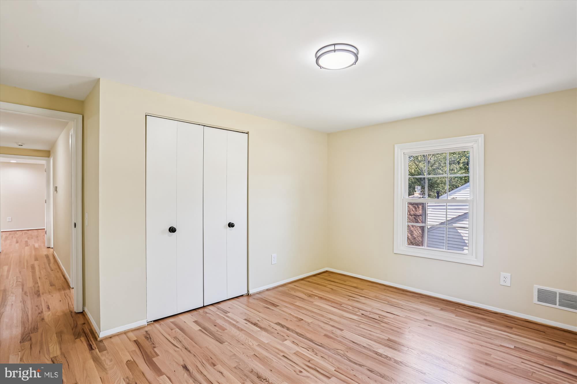 9017 Falls Chapel Way Potomac, MD 20854 - Photo 50 of 70 a view of a room with wooden floor and windows