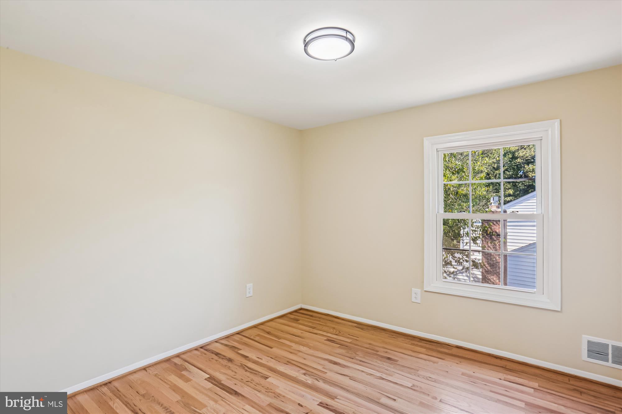 9017 Falls Chapel Way Potomac, MD 20854 - Photo 54 of 70 an empty room with wooden floor and windows